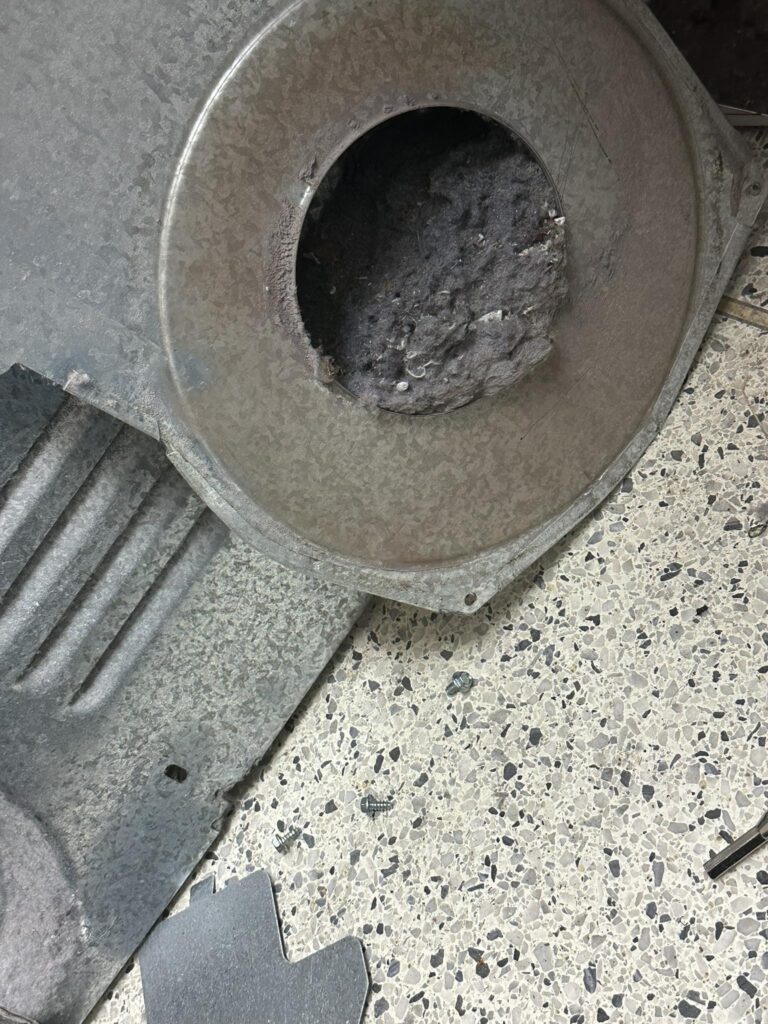 Lint buildup inside dryer caused by a clogged dryer vent in Lubbock TX