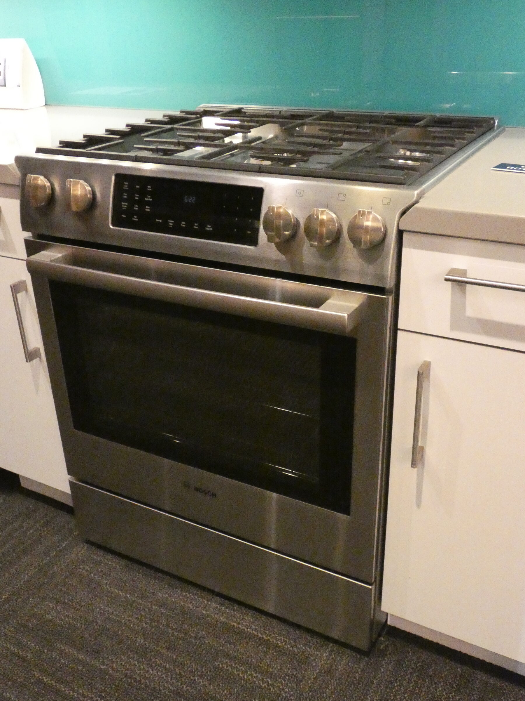 Built-in wall oven in kitchen where model and serial number tag is typically found on the door frame