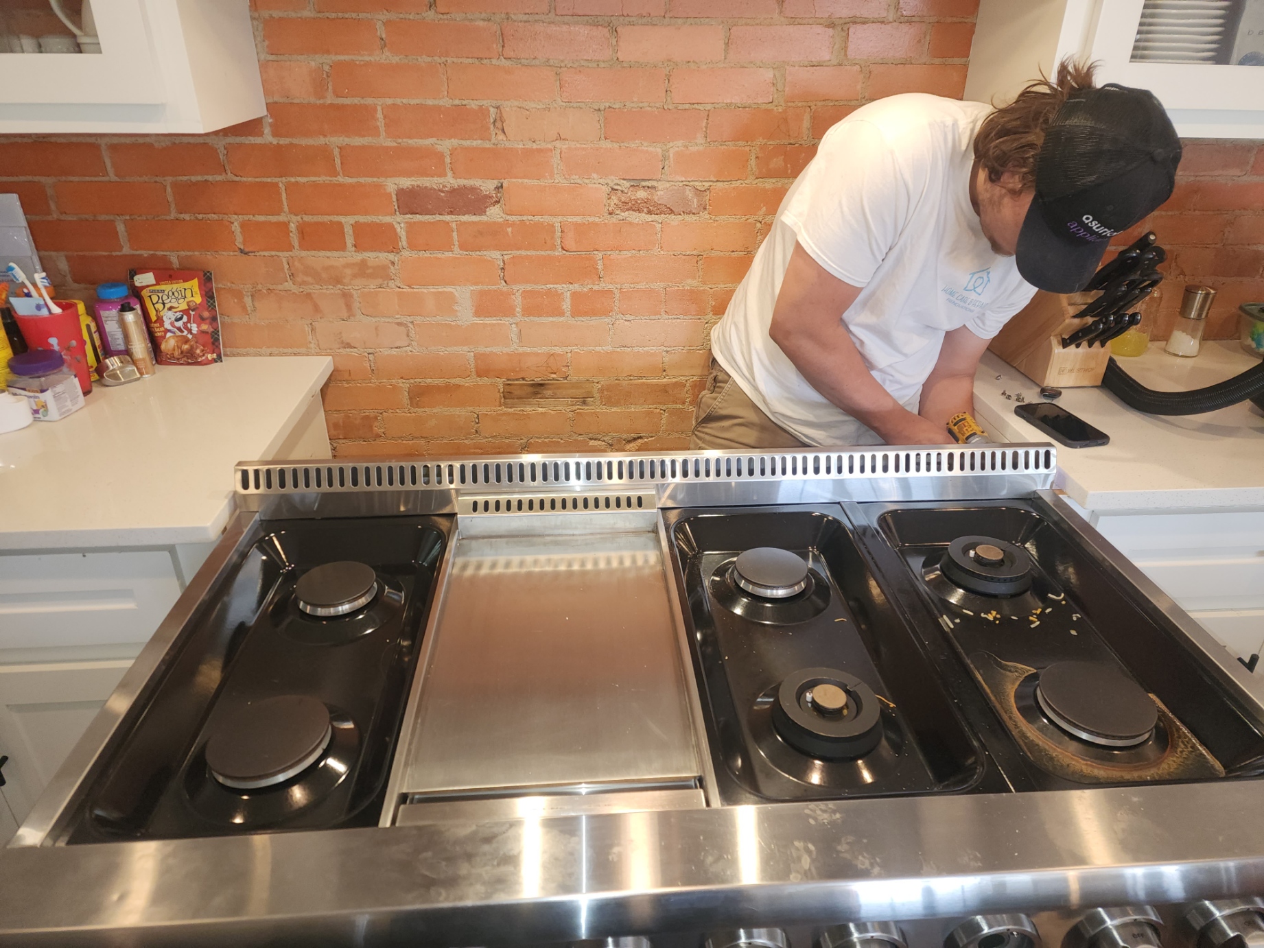 Oven and range repair in Lubbock - technician servicing a ZLINE gas range